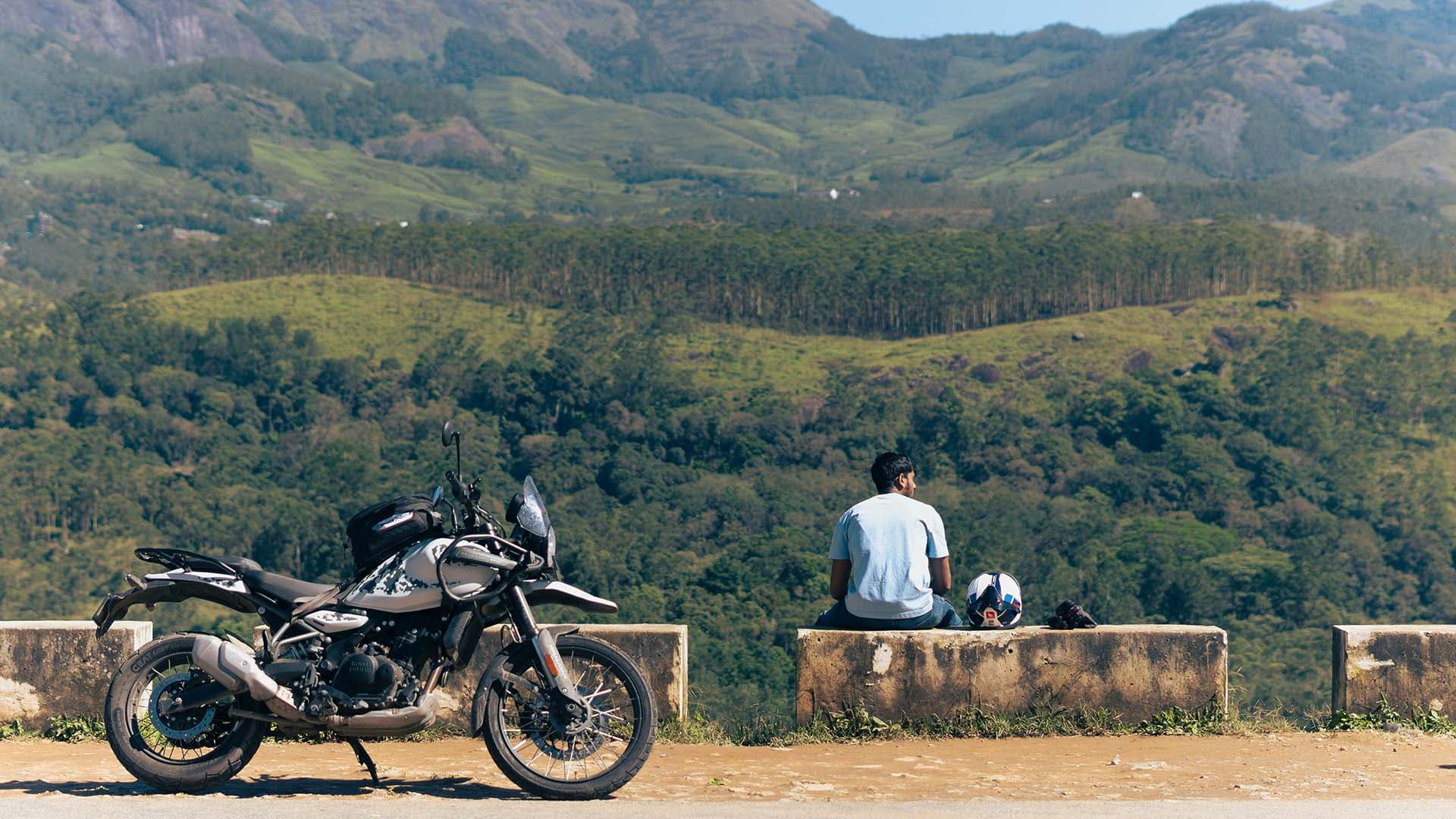Motorcycle rider stopped at a scenic overlook